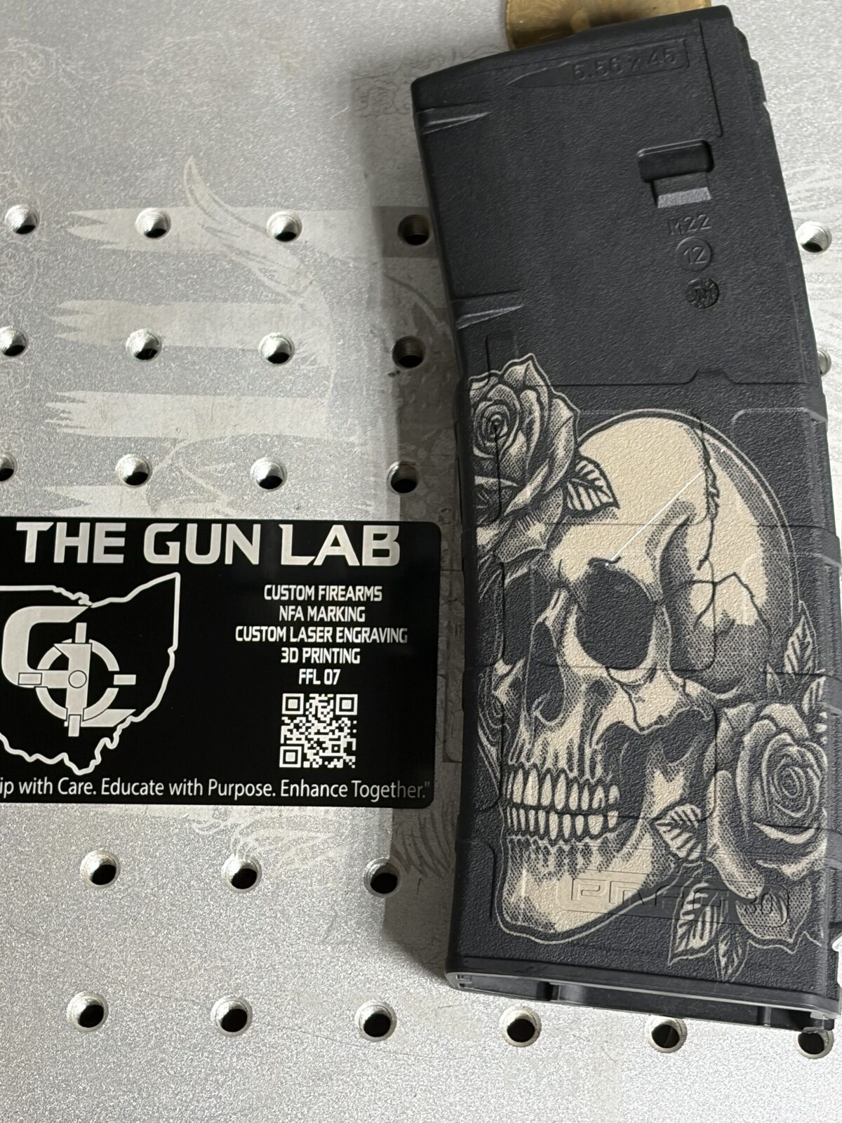 Skull and Roses design laser-engraved on a PMAG