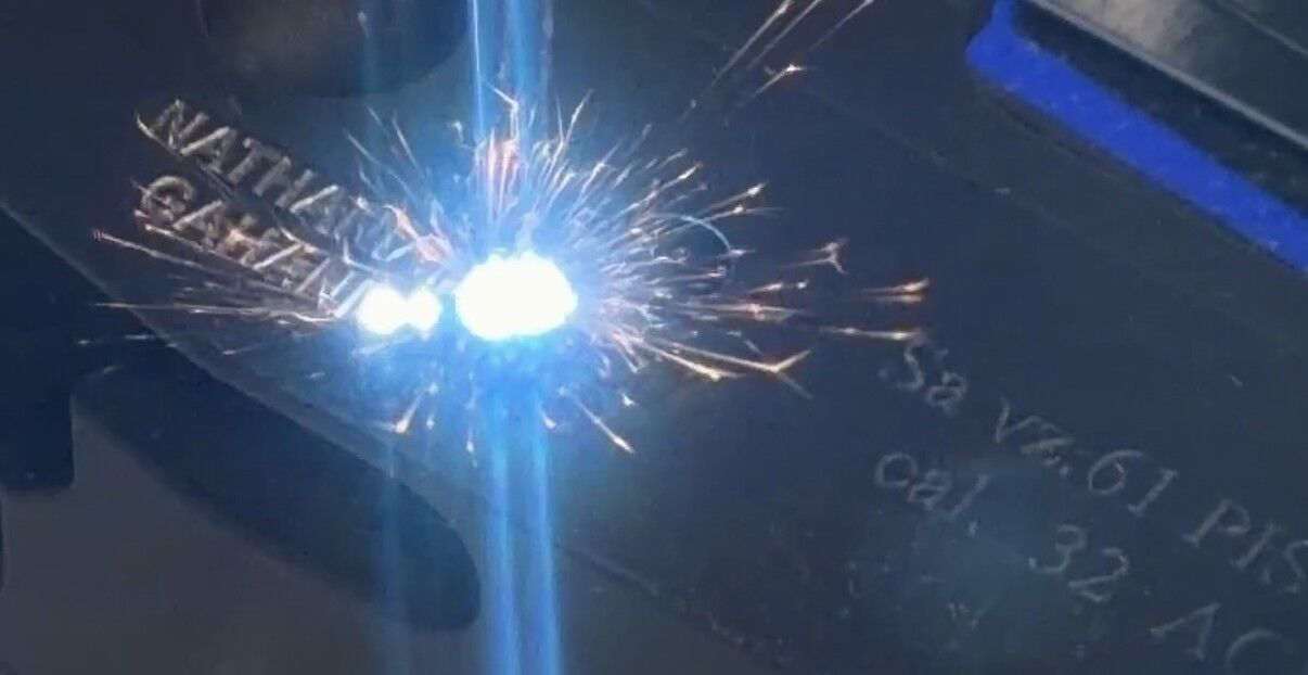 Fiber laser throwing sparks mid-engrave